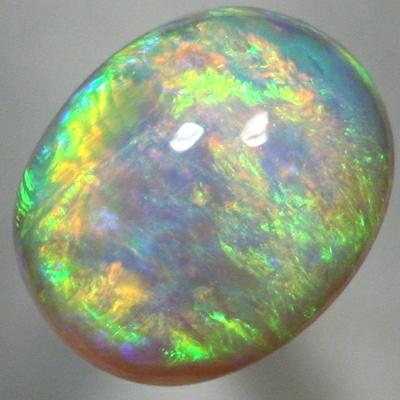 SOLID CRYSTAL OPAL High dome with very bright rolling flash, orange to green. SEE VIDEO